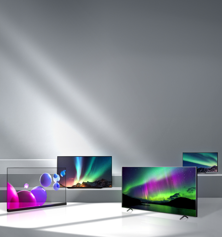 On the stairs are several TVs with OLED panels from LG display, with colorful graphic images floating on the screens.